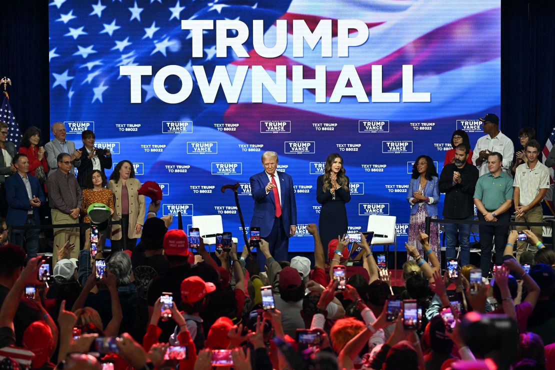 Former President Donald Trump and South Dakota Governor Kristi Noem during an election town hall at the Greater Philadelphia Expo Center and Fairgrounds in Oaks, Pennsylvania on October 14, 2024.