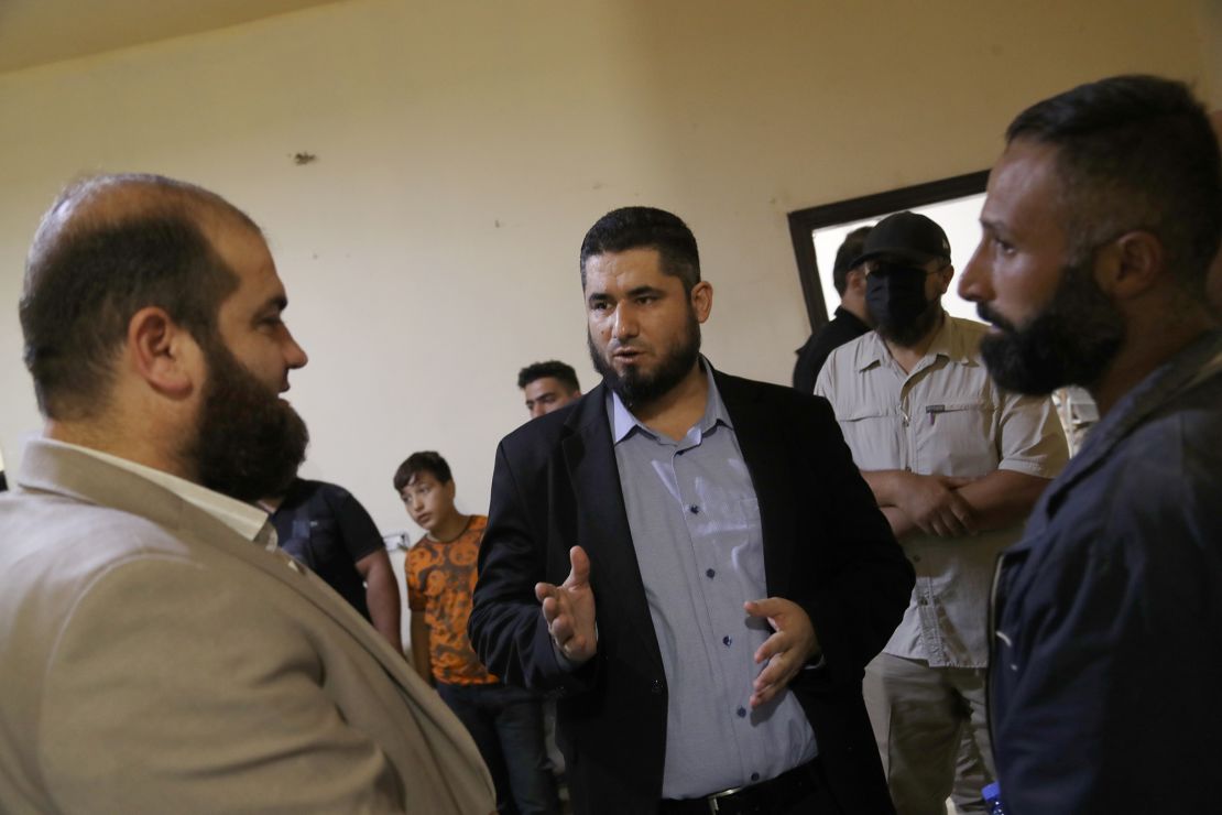 Displaced Syrians arrive in Idlib from Lebanon on October 10th. In the center of the photo, Mohammed Abd al-Rahman, Minister of Interior of the Syrian National Salvation Government, affiliated with Hayat Tahrir al-Sham, is seen inspecting the registration process. Syrian refugees fleeing Lebanon.