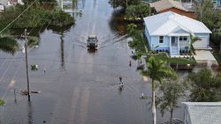 PUNTA GORDA - OCTOBER 10: In this aerial view, a person walks through flood waters that inundated a neighborhood after Hurricane Milton came ashore on October 10, 2024, in Punta Gorda, Florida. The storm made landfall as a Category 3 hurricane in the Siesta Key area of Florida, causing damage and flooding throughout Central Florida. (Photo by Joe Raedle/Getty Images)