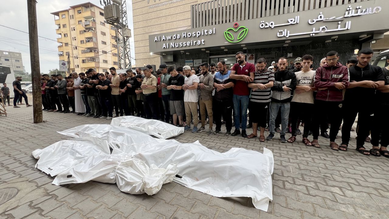 Relatives of Palestinians who lost their life after Israeli attacks at Nusierat refugee camp, perform funeral prayer at Al-Awda Hospital, Gaza, on October 15.