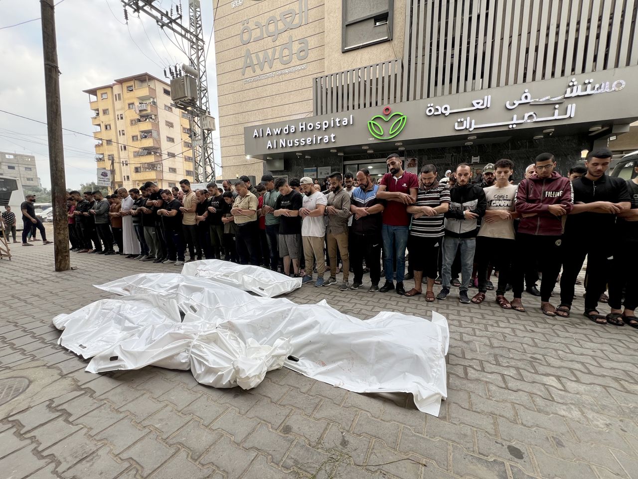 Relatives of Palestinians who lost their life after Israeli attacks at Nusierat refugee camp, perform funeral prayer at Al-Awda Hospital, Gaza, on October 15.