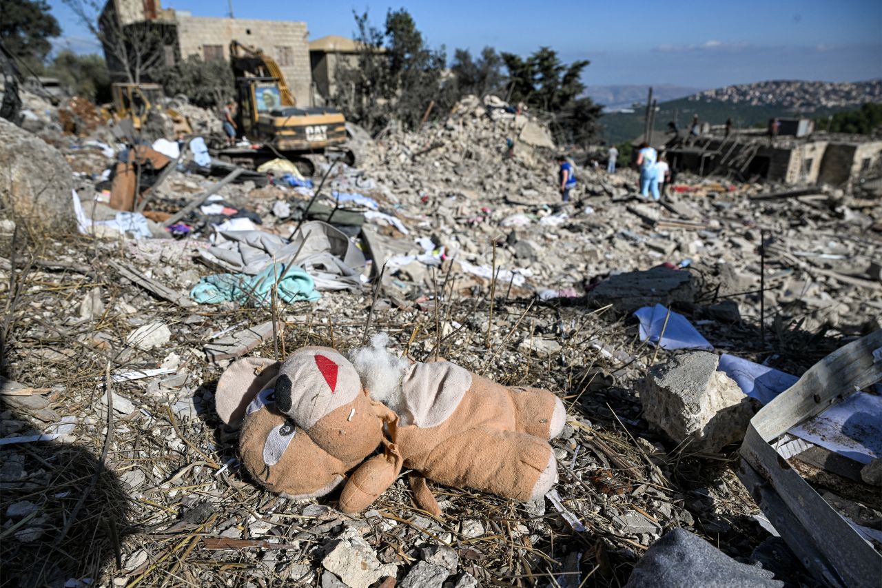 A torn plush bear doll is strewn among debris and rubble at the site of a Israeli air strike, in the village of Aito in northern Lebanon, on October 15, 2024.