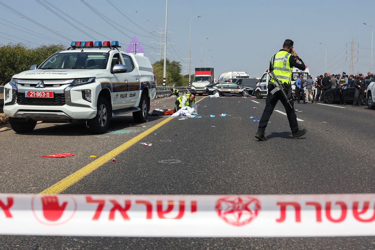 Members of Israeli security and emergency services deploy at the site of a shooting on the Yavne interchange, near the southern Israeli city of Ashdod, on October 15.