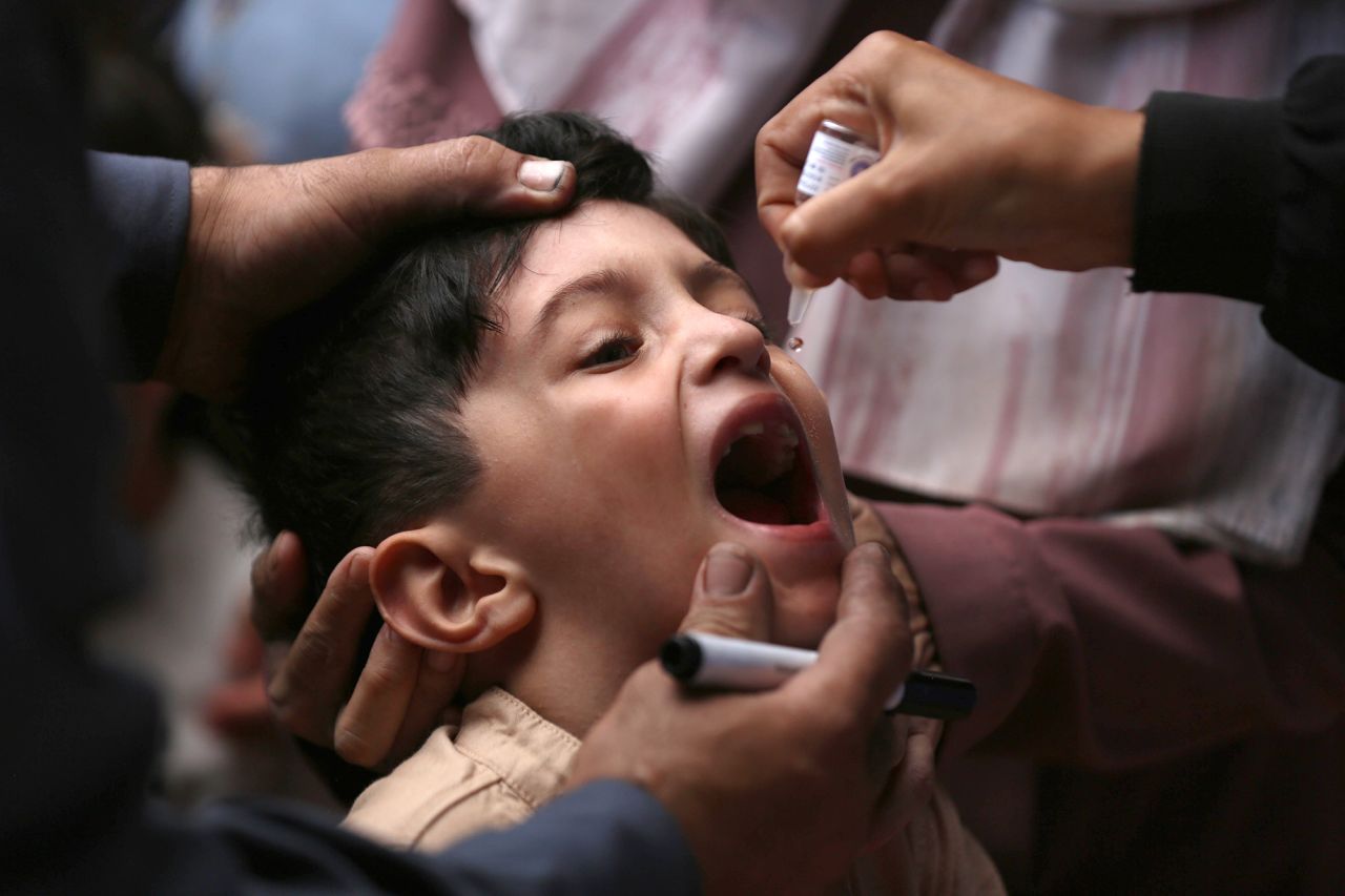 A Palestinian child receives a polio vaccination at a UNRWA clinic as part of the second phase of the polio vaccination campaign for children under 10 years old in Deir al-Balah, Gaza, on October 15.