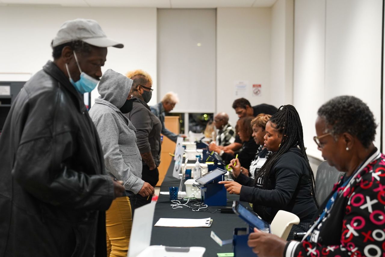 Voters are processed on the first day of early voting in Atlanta on Tuesday.