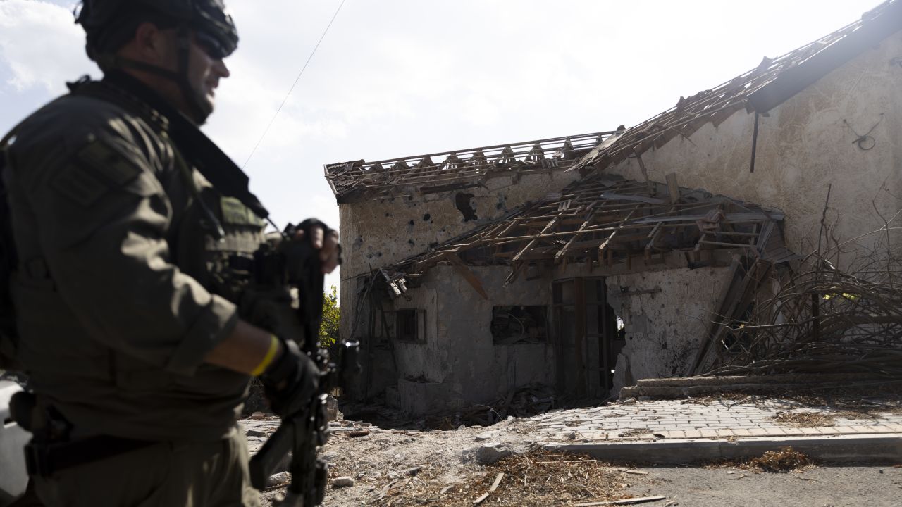 METULA, ISRAEL - OCTOBER 15: A member of the village security squad inspect a house that was damaged by missile fired by Hezbollah during a media tour to the village on October 15, 2024 in Metula, Israel. The Israel Defense Forces (IDF) led members of the media on a tour into the closed military zone at Metula, Israel's northernmost point along the border with Lebanon, which has seen heavy rocket fire. The war between Israel and Hezbollah has entered a new phase as Israel has launched a ground offensive in southern Lebanon and escalated its aerial campaign there. Meanwhile, Hezbollah has continued firing rockets into northern Israel, a regular occurrence since Oct. 7 of last year, when the Iran-backed militant group said it was attacking Israel in solidarity with Hamas in Gaza. (Photo by Amir Levy/Getty Images)