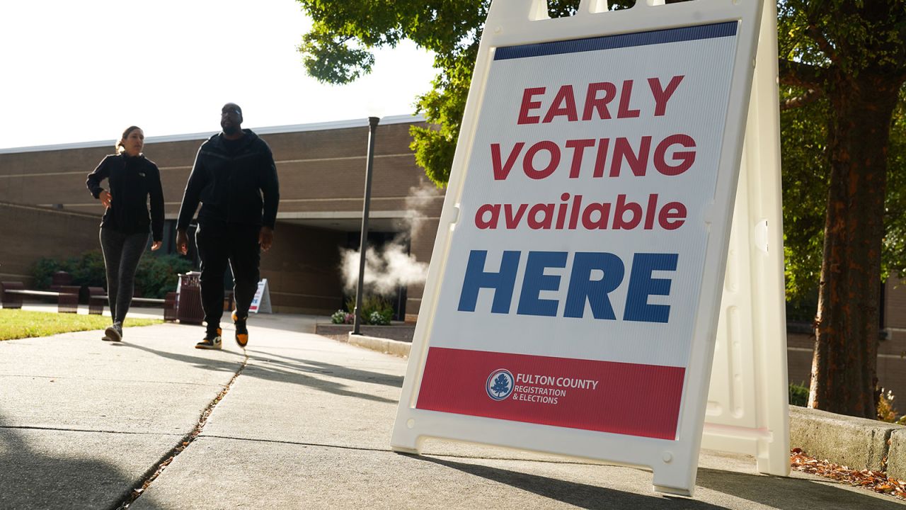 Signs direct people where to go to cast their votes on the first day of early voting at Atlanta Metropolitan State College on October 15, in Atlanta, Georgia.