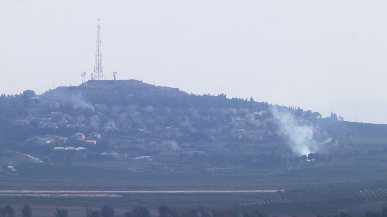 Smoke rises from Metula in northern Israel after a rocket was fired from southern Lebanon near the settlement on October 15, as seen from Marjayoun, Lebanon.