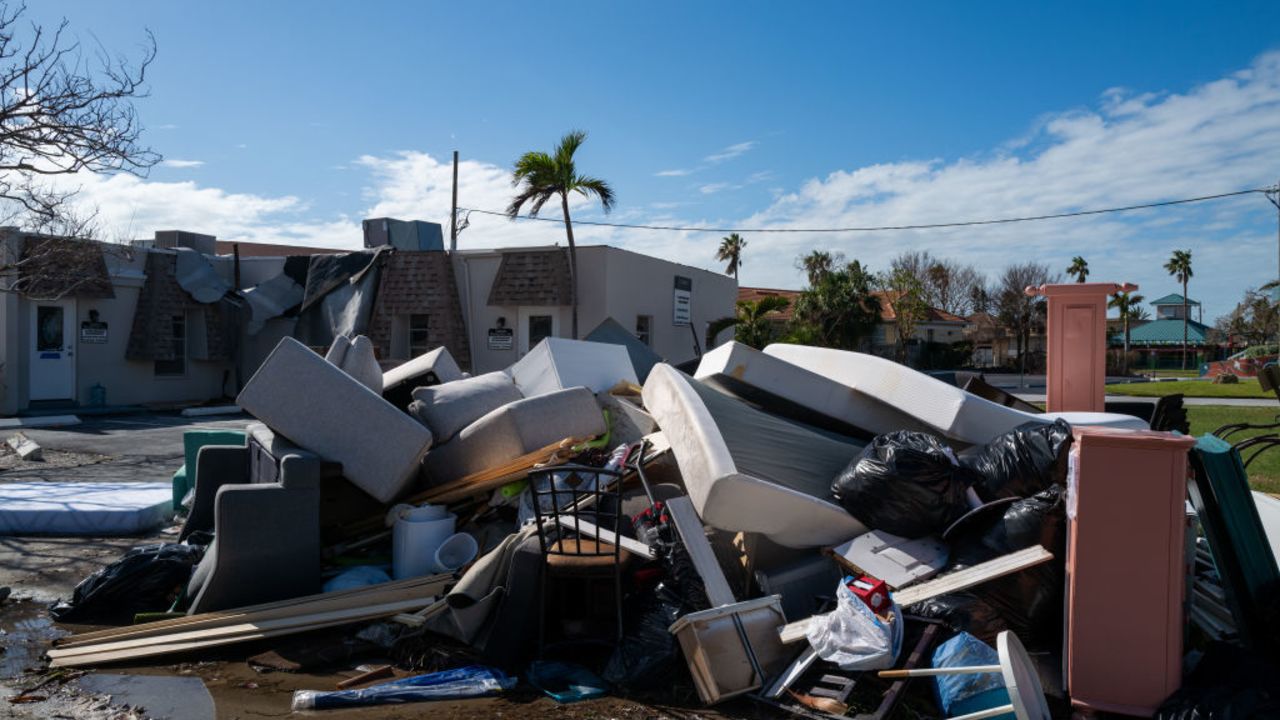 TREASURE ISLAND, FLORIDA - OCTOBER 10: Damaged household goods sit outside as clean up from hurricanes Helene and Milton continues along the Gulf Coast on October 10, 2024 in Treasure Island, Florida. Milton, coming just days after Helene, spawned dozens of tornadoes that crisscrossed the state, with five deaths attributed to the twisters so far, according to published reports.  (Photo by Spencer Platt/Getty Images)