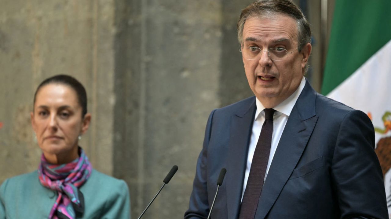 Mexican Economy Minister Marcelo Ebrard (R) speaks next to Mexican President Claudia Sheinbaum during the High Level Summit between Mexican and US leaders and businessmen at the National Palace in Mexico City on October 15, 2024. (Photo by Yuri CORTEZ / AFP) (Photo by YURI CORTEZ/AFP via Getty Images)