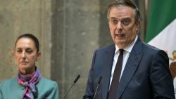 Mexican Economy Minister Marcelo Ebrard (R) speaks next to Mexican President Claudia Sheinbaum during the High Level Summit between Mexican and US leaders and businessmen at the National Palace in Mexico City on October 15, 2024. (Photo by Yuri CORTEZ / AFP) (Photo by YURI CORTEZ/AFP via Getty Images)