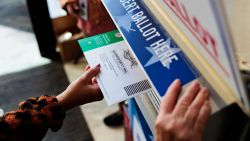 A person drops off a mail-in ballot on October 15, 2024 in Doylestown, Pennsylvania. Registered voters in Pennsylvania can vote "On Demand" by requesting, a mail-in or absentee ballot filing it out and dropping it off all in one visit to their county election office or other designated location.