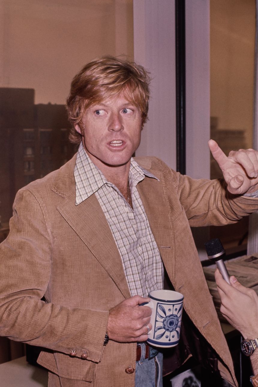 Tactile textiles such as corduroy gave Redford's outfit's a more bohemian edge. Here, he is photographed on set for 