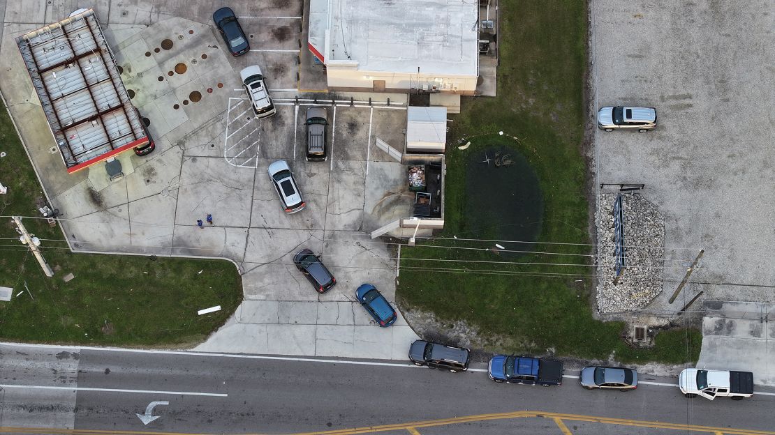 An aerial view of vehicles lined up to wait for gas at a Circle K gas station on October 11, 2024 in Englewood, Florida. Gas stations in Florida are out of fuel after the storm made landfall in the Siesta Key region of Florida as a Category 3 hurricane and caused damage and flooding across Central Florida.