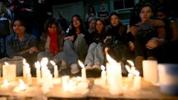 TOPSHOT - Fans of British singer Liam Payne lit candles next to the hotel where he died in Buenos Aires on October 16, 2024. British singer Liam Payne, former member of the group One Direction, died Wednesday aged 31 after falling from the third floor of a hotel in Argentina, police in Buenos Aires said. (Photo by Luis ROBAYO / AFP) (Photo by LUIS ROBAYO/AFP via Getty Images)