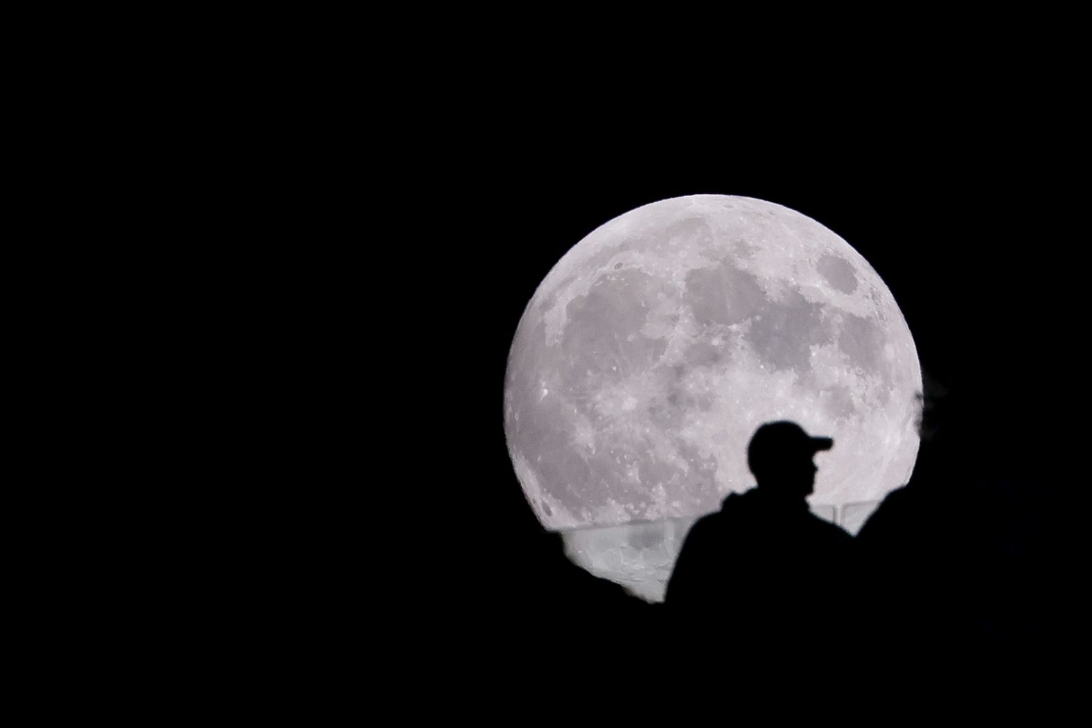 The moon rises behind Citi Field in New York before Game 3 of the National League Championship Series between the New York Mets and the Los Angeles Dodgers on Wednesday.