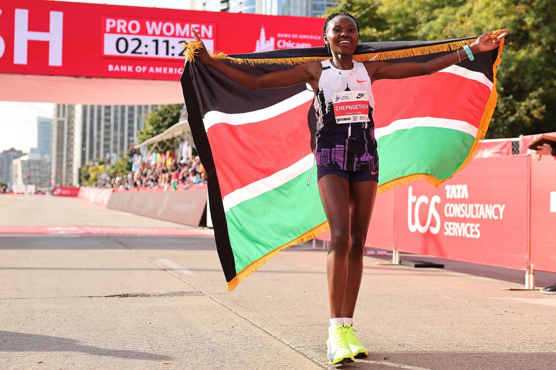 Ruth Chepngetich of Kenya celebrates after crossing the finish line to win the 2024 Chicago Marathon professional women's division.