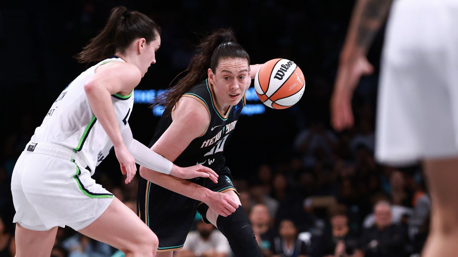 New York Liberty forward Breanna Stewart driving past Minnesota Lynx forward Bridget Carleton in Game 2 of the WNBA Finals.