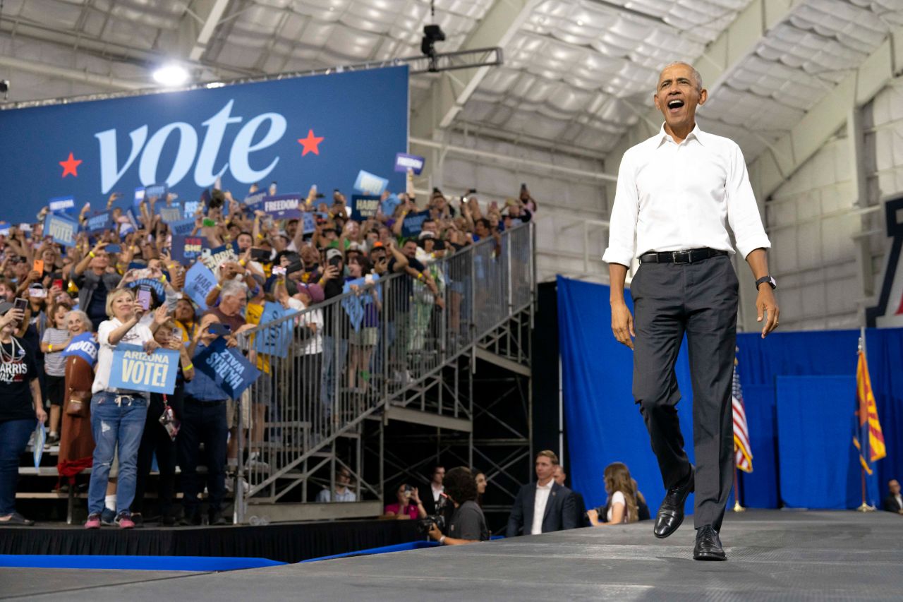 Former President Barack Obama walks on stage during a campaign rally for Vice President Kamala Harris in Tucson, Arizona, on October 18.