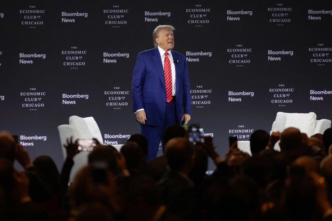 Former President Donald Trump leaves the stage following an interview with Bloomberg News Editor-in-Chief John Micklethwait, during a luncheon hosted by the Economic Club on October 15, 2024.