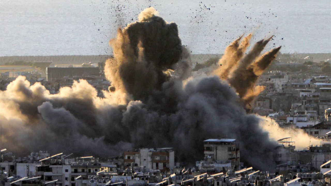 TOPSHOT - A cloud of smoke erupts following an Israeli airstrike on Beirut's southern suburbs on October 19, 2024. Israel expanded operations in Lebanon nearly a year after Hezbollah began exchanging fire in support of its ally, Hamas, following the Palestinian group's deadly attack on Israel on October 7, 2023. (Photo by AFP) (Photo by -/AFP via Getty Images)