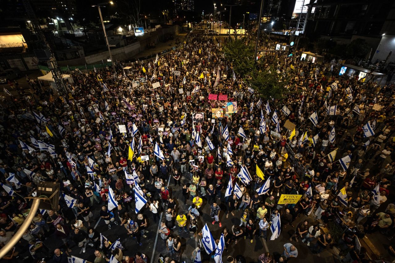 Hundreds of protesters are seen in Tel Aviv on Saturday.