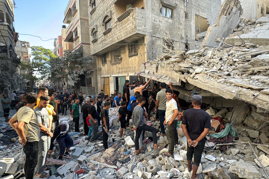 Palestinians inspect the damage after an Israeli airstrike the previous night in Beit Lahia, in the northern Gaza Strip on Sunday.