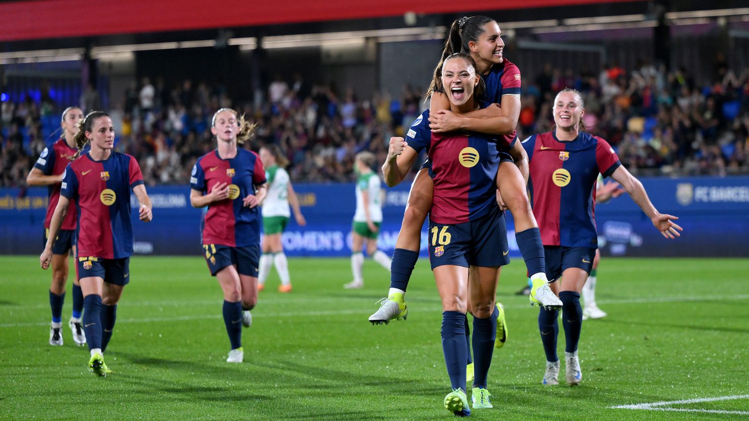 Fridolina Rolf? celebrates with teammate Kika Nazareth after scoring Barcelona's ninth goal from a penalty kick.