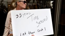 LOS ANGELES, CALIFORNIA - OCTOBER 16: A supporter holds a sign at a press conference with Menendez family members outside the Criminal Courts Building on October 16, 2024 in Los Angeles, California. Members of the Menendez family held the news conference to call for the release of brothers Lyle and Erik Menendez from prison nearly thirty years after their conviction in 1996 for killing their parents in Beverly Hills. The district attorney’s office is looking at new evidence which supports the brothers’ claim they were sexually abused by their father. (Photo by Mario Tama/Getty Images)