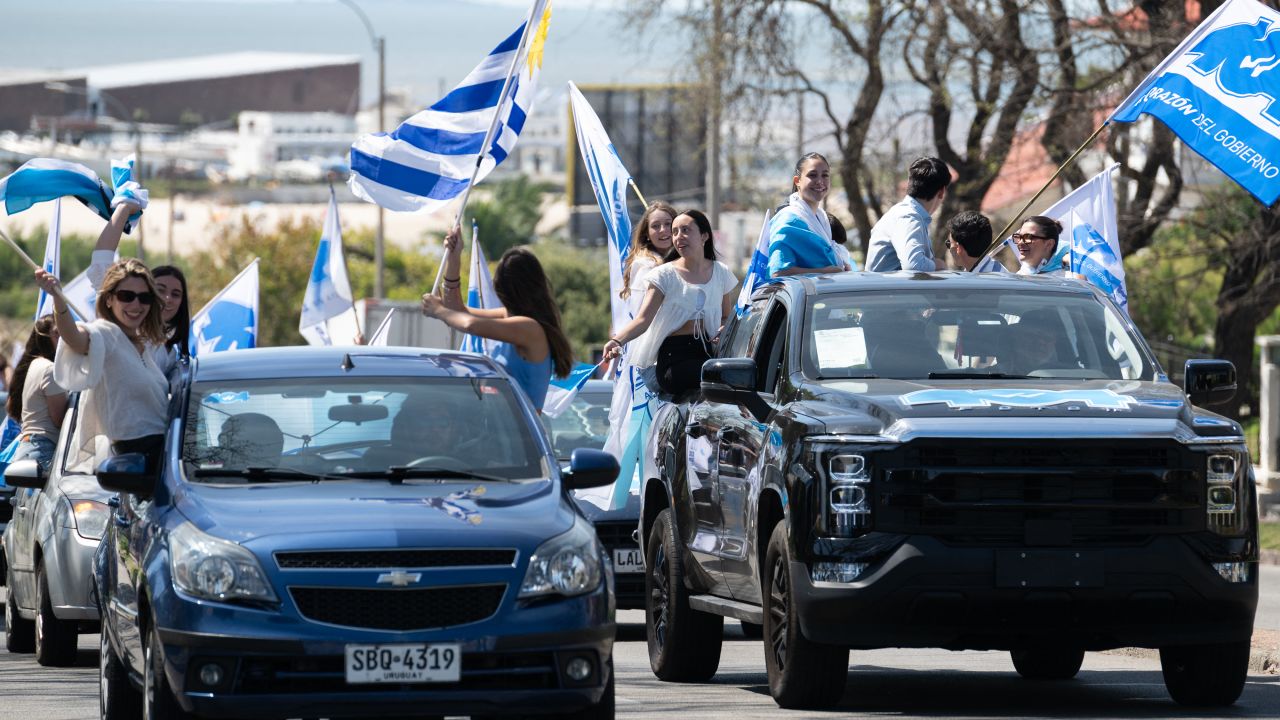 Supporters of Uruguay's presidential candidate for the Nacional party, Alvaro Delgado, attend a campaign rally in Montevideo on October 20, 2024. Uruguay will hold presidential elections on October 27. (Photo by Santiago MAZZAROVICH / AFP) (Photo by SANTIAGO MAZZAROVICH/AFP via Getty Images)