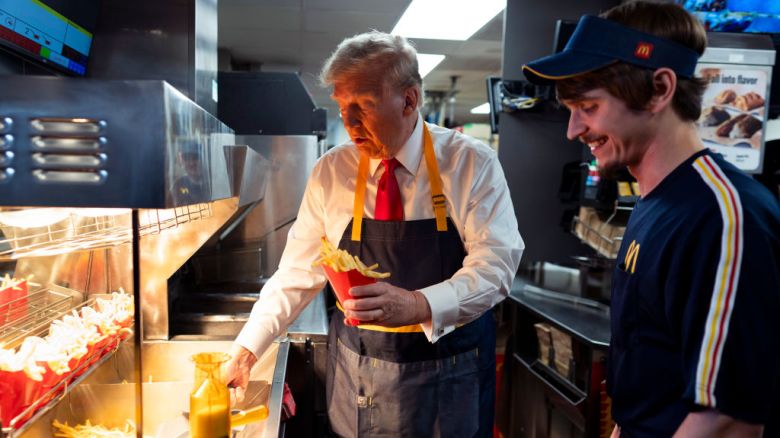 FEASTERVILLE-TREVOSE, PENNSYLVANIA - OCTOBER 20: Republican presidential nominee, former U.S. President Donald Trump works behind the counter during a visit to McDonald's restaurant on October 20, 2024 in Feasterville-Trevose, Pennsylvania. Trump is campaigning the entire day in the state of Pennsylvania. Trump and Democratic presidential nominee Vice President Kamala Harris continue to campaign in battleground swing states ahead of the November 5th election. (Photo by Doug Mills-Pool/Getty Images)