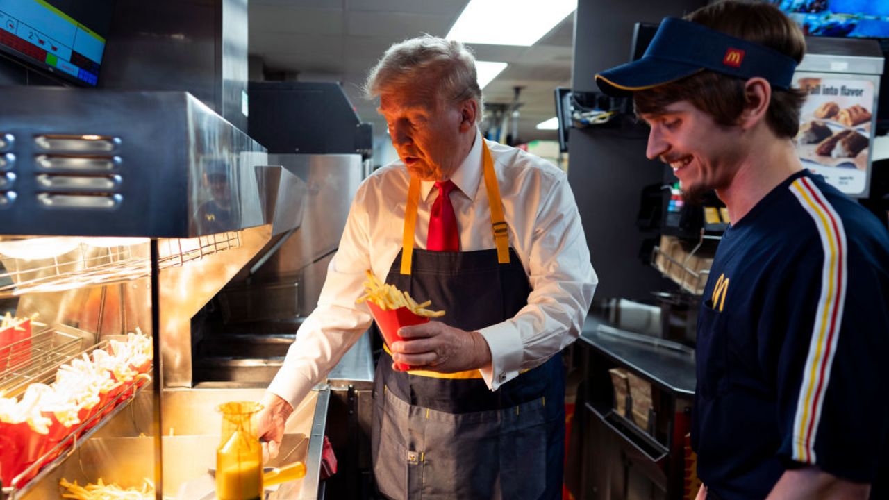 FEASTERVILLE-TREVOSE, PENNSYLVANIA - OCTOBER 20: Republican presidential nominee, former U.S. President Donald Trump works behind the counter during a visit to McDonald's restaurant on October 20, 2024 in Feasterville-Trevose, Pennsylvania. Trump is campaigning the entire day in the state of Pennsylvania. Trump and Democratic presidential nominee Vice President Kamala Harris continue to campaign in battleground swing states ahead of the November 5th election. (Photo by Doug Mills-Pool/Getty Images)