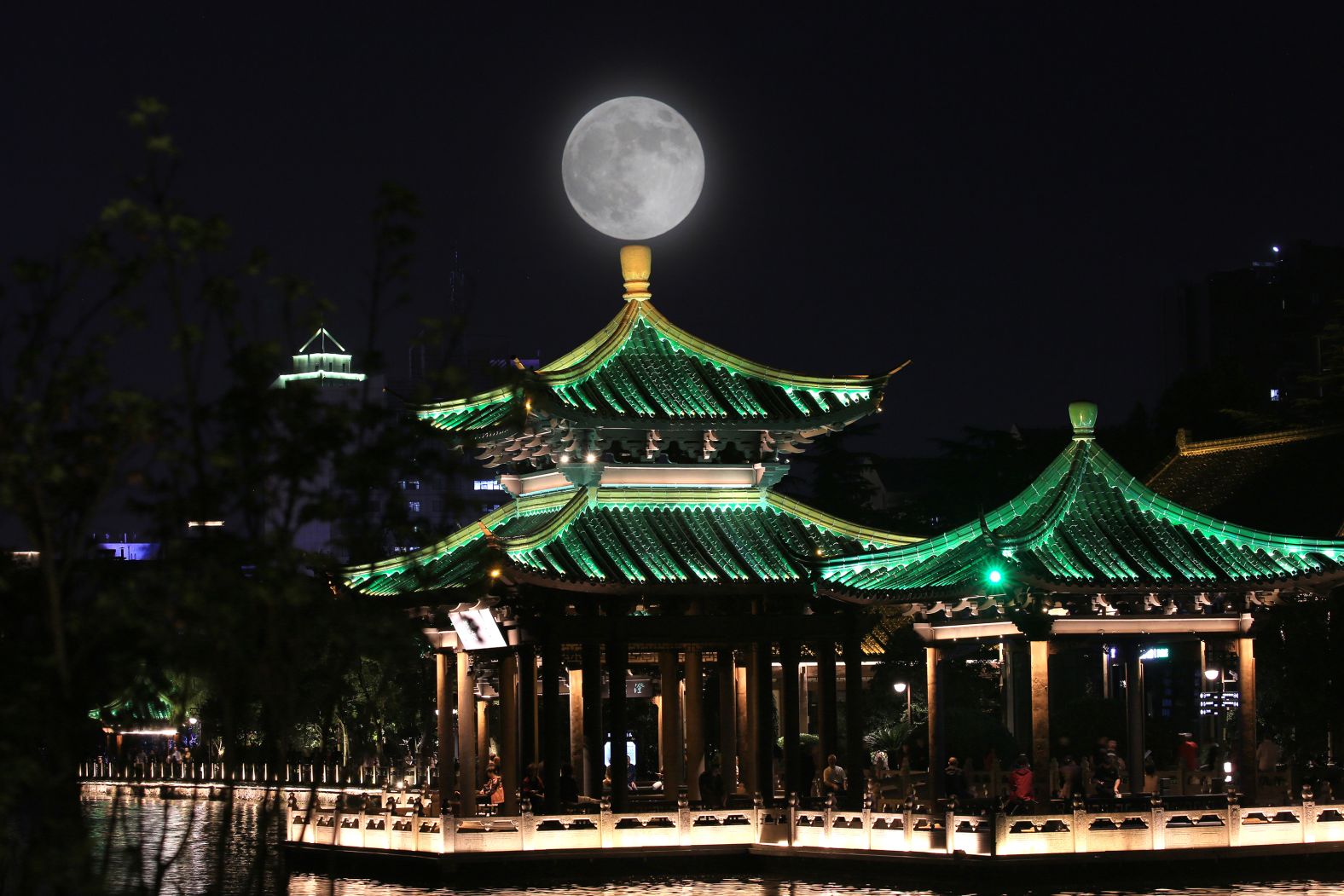 NANTONG, CHINA - OCTOBER 17: (EDITORS NOTE: Multiple exposures were combined in camera to produce this image) The full hunter's moon rises in the night sky on October 17, 2024 in Nantong, Jiangsu Province of China. The hunter's moon is the first full moon after the autumnal equinox, which occurred on September 22 in 2024. Super Hunter's moon on October 17 will be the biggest and brightest full moon of 2024. (Photo by VCG/VCG via Getty Images)