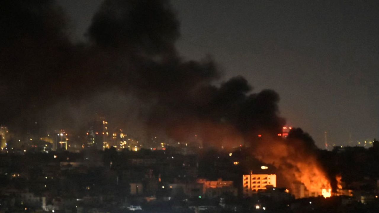 Smoke and flames rise from areas targeted by an Israeli airstrike in Beirut's southern suburbs late on October 20, 2024. (Photo by Fadel ITANI / AFP) (Photo by FADEL ITANI/AFP via Getty Images)