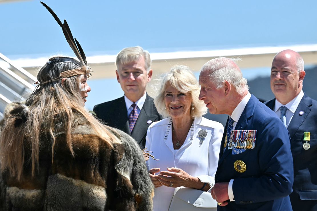 King Charles III (2nd R) and Queen Camilla are greeted by Ngunnawal Elder Aunty Serena Williams (L) upon their arrival at Defence Establishment Fairbairn, Canberra Airport on October 21, 2024, in Canberra, Australia.