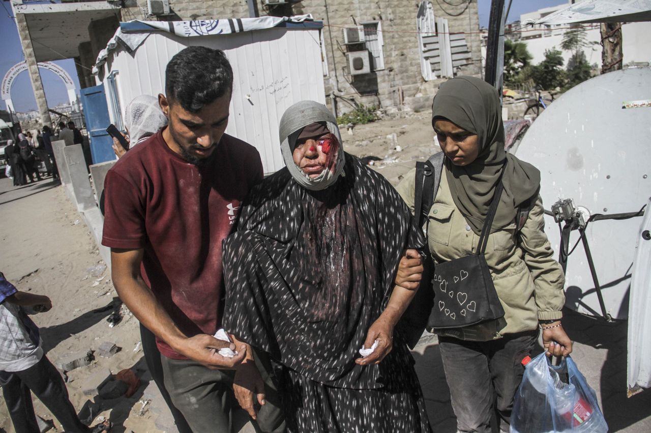 Wounded Palestinians, including children, are brought to al-Ahli Baptist Hospital for treatment after an Israeli attack on Jabalya refugee camp, Gaza, on October 21.