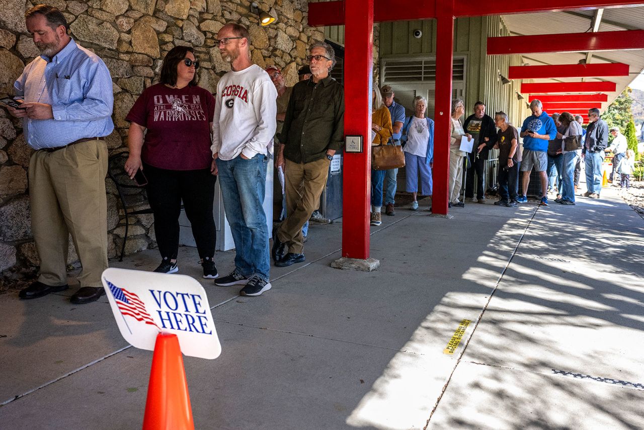 People line up for early voting at a polling station at the Black Mountain Public Library in Black Mountain, North Carolina, on October 21.