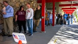 People line up for early voting at a polling station at the Black Mountain Public Library in Black Mountain, North Carolina on October 21, 2024. (Photo by Jim WATSON / AFP) (Photo by JIM WATSON/AFP via Getty Images)