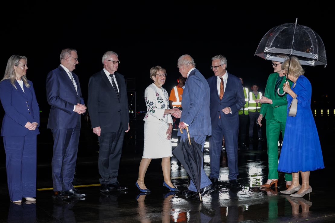 Australian officials greet King Charles III and Queen Camilla as they arrive at Sydney Airport on October 18, 2024.