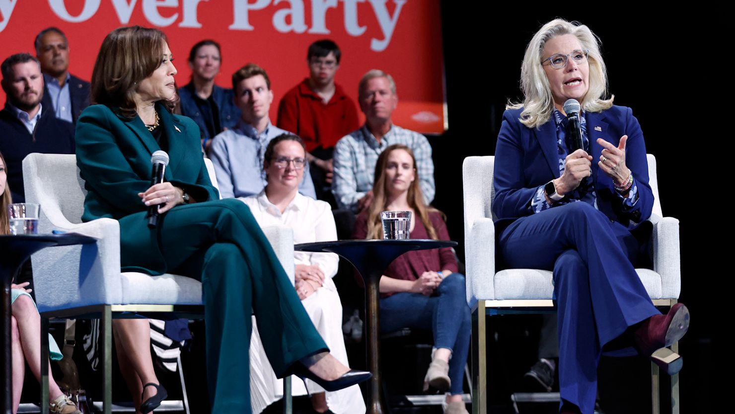 Vice President Kamala Harris, left, listens as former Rep. Liz Cheney speaks during a moderated conversation at Sharon Lynne Wilson Center for the Arts in Brookfield, Wisconsin, on October 21, 2024.