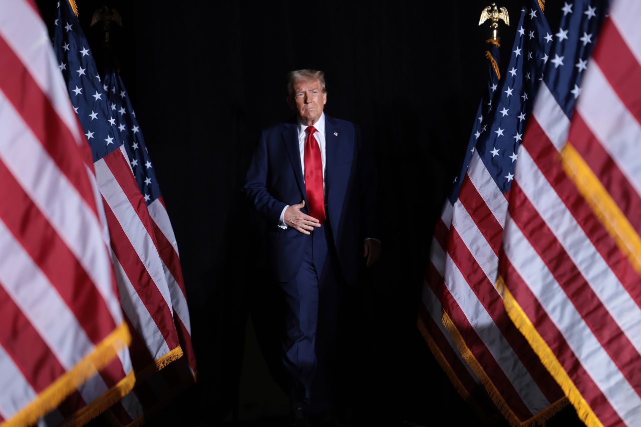 Former President Donald Trump arrives on stage at a campaign rally in Detroit on October 18.