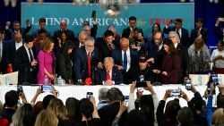 TOPSHOT - Former US President and Republican presidential candidate Donald Trump prays during a roundtable discussion with Latino community leaders at Trump National Doral Miami resort in Miami, Florida, on October 22, 2024. (Photo by CHANDAN KHANNA / AFP) (Photo by CHANDAN KHANNA/AFP via Getty Images)