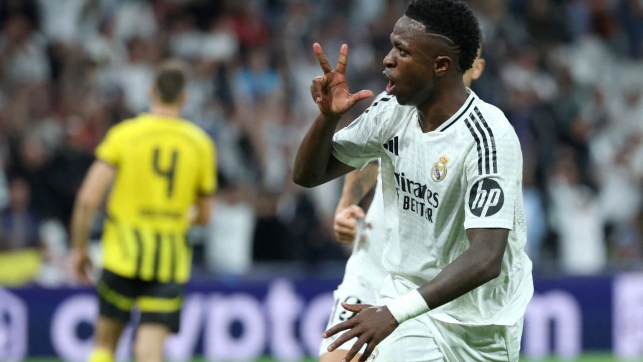 Real Madrid's Brazilian forward #07 Vinicius Junior celebrates scoring a hat-trick and his team's fifth goal during the UEFA Champions League, league phase day 3 football match between Real Madrid CF and Borussia Dortmund at the Santiago Bernabeu stadium in Madrid on October 22, 2024. (Photo by Thomas COEX / AFP) (Photo by THOMAS COEX/AFP via Getty Images)