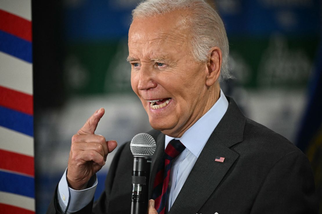 President Joe Biden speaks to staff as he visits a Democratic-coordinated New Hampshire campaign office in Concord on Oct. 22, 2024.