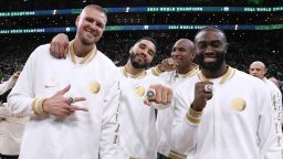 BOSTON, MA - OCTOBER 22: Kristaps Porzingis #8, Al Horford #42, Jayson Tatum #0 and Jaylen Brown #7 of the Boston Celtics pose for a photo with their 2024 Championship rings before the game against the New York Knicks on October 22, 2024 at TD Garden in Boston, Massachusetts. NOTE TO USER: User expressly acknowledges and agrees that, by downloading and/or using this Photograph, user is consenting to the terms and conditions of the Getty Images License Agreement. Mandatory Copyright Notice: Copyright 2024 NBAE (Photo by Brian Babineau/NBAE via Getty Images)