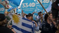 Supporters of Uruguay's presidential candidate for the Partido Nacional (National Party) Alvaro Delgado attend the campaign closing rally in Las Piedras, Canelones, Uruguay, on October 22, 2024, ahead of the upcomig prsidential election. If no candidate gets more than 50 percent on the October 27 presidential election, the two most voted will have to face a runoff on November 24. (Photo by EITAN ABRAMOVICH / AFP) (Photo by EITAN ABRAMOVICH/AFP via Getty Images)