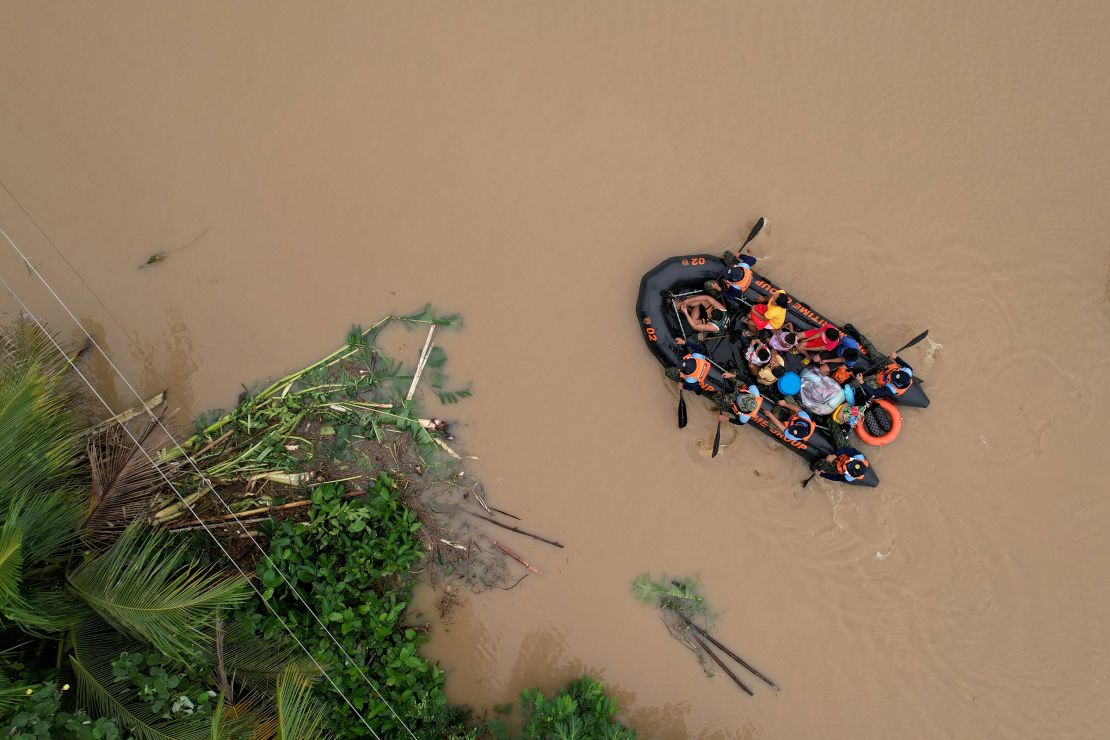 An aerial photo shows a Coast Guard rescue boat evacuating residents to safer areas in Polangui town in Albay province, south of Manila, Philippines, on October 23, 2024.