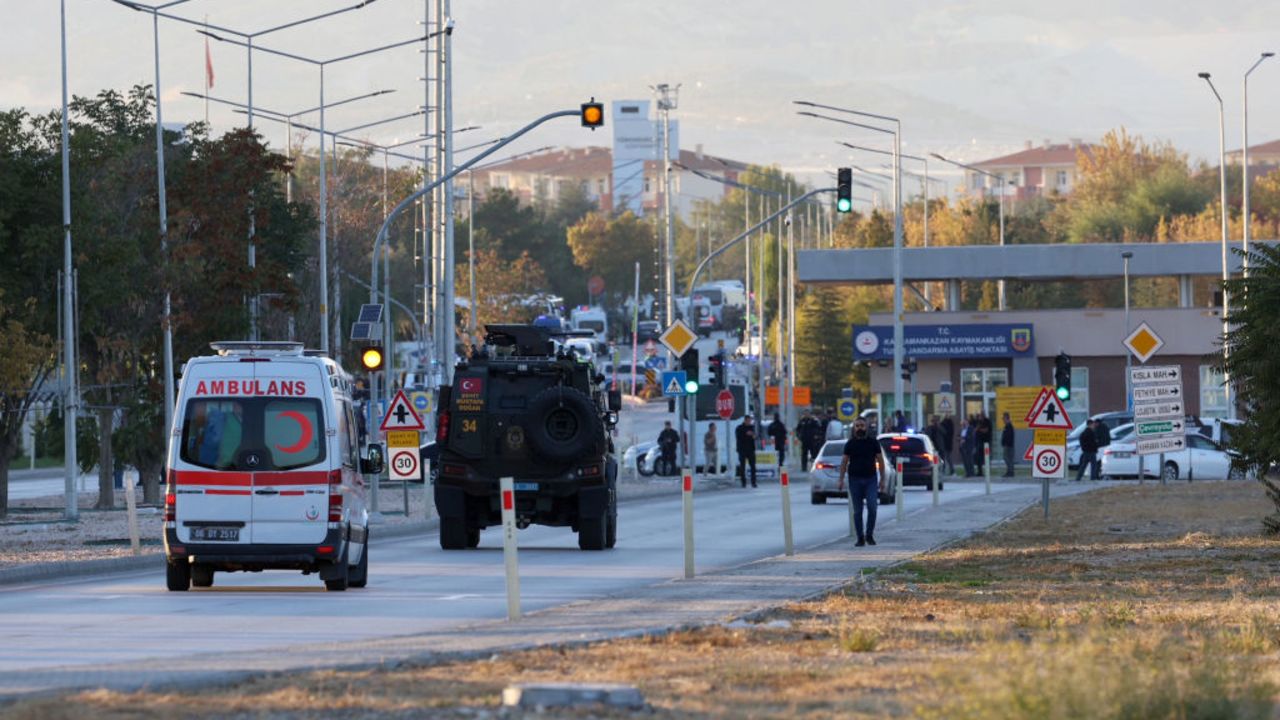 TOPSHOT - An armoured personnel vehicle and an ambiulance move along a road in Kahramankazan, some 40 kilometers (25 miles) north of Ankara on October 23, 2024, near the gate of the Turkish Aerospace Industries (TAI), after a huge explosion outside the headquarters left a number of people "dead and injured", Turkey's interior minister said, describing it as a "terrorist attack". (Photo by Adem ALTAN / AFP) (Photo by ADEM ALTAN/AFP via Getty Images)