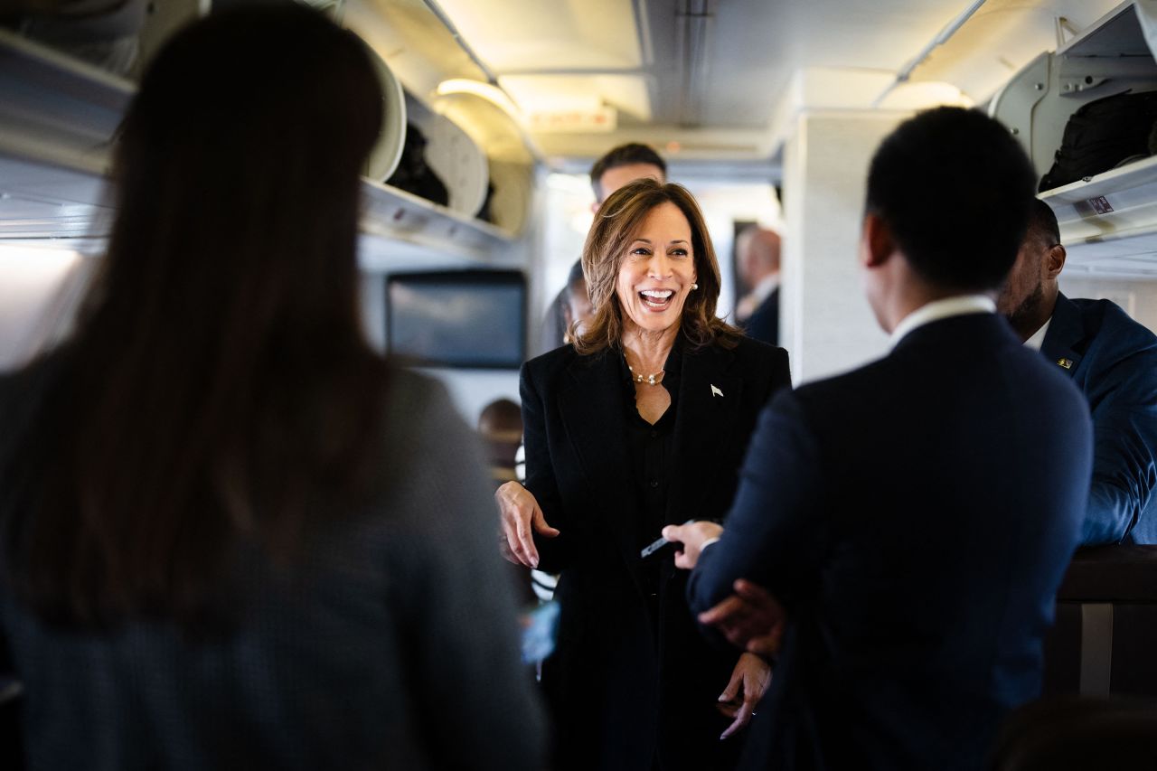 Vice President Kamala Harris talks to reporters aboard Air Force Two at Joint Base Andrews in Maryland on October 23.