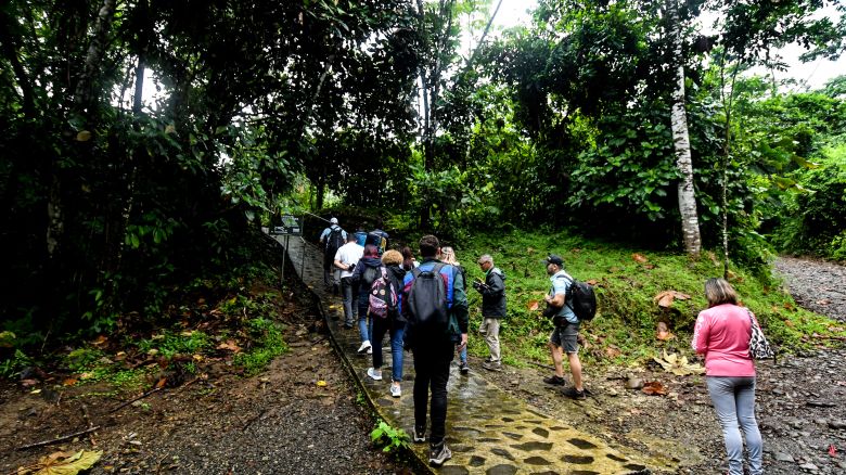 Tourists visit a Maleku village near the town of La Fortuna, about 170 km north of San Jose, on October 11, 2024. The Maleku are one of Costa Rica's eight native peoples, who together represent 2.4% of the country's 5.2 million inhabitants, according to official figures. This ethnic group has lived in this area for hundreds of years, but they are a minority group in the country, as it is estimated that there are no more than a thousand individuals. (Photo by Ezequiel BECERRA / AFP) (Photo by EZEQUIEL BECERRA/AFP via Getty Images)